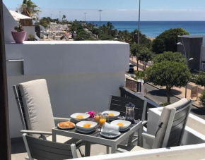 Location location,Seafront apartment with communal pool.